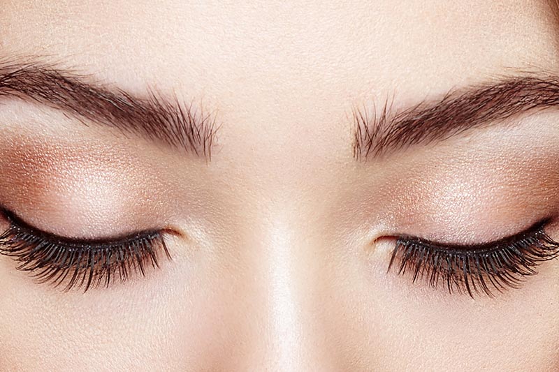 woman long eyelash extensions