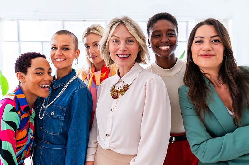 group of women smiling aftrer facial treatment